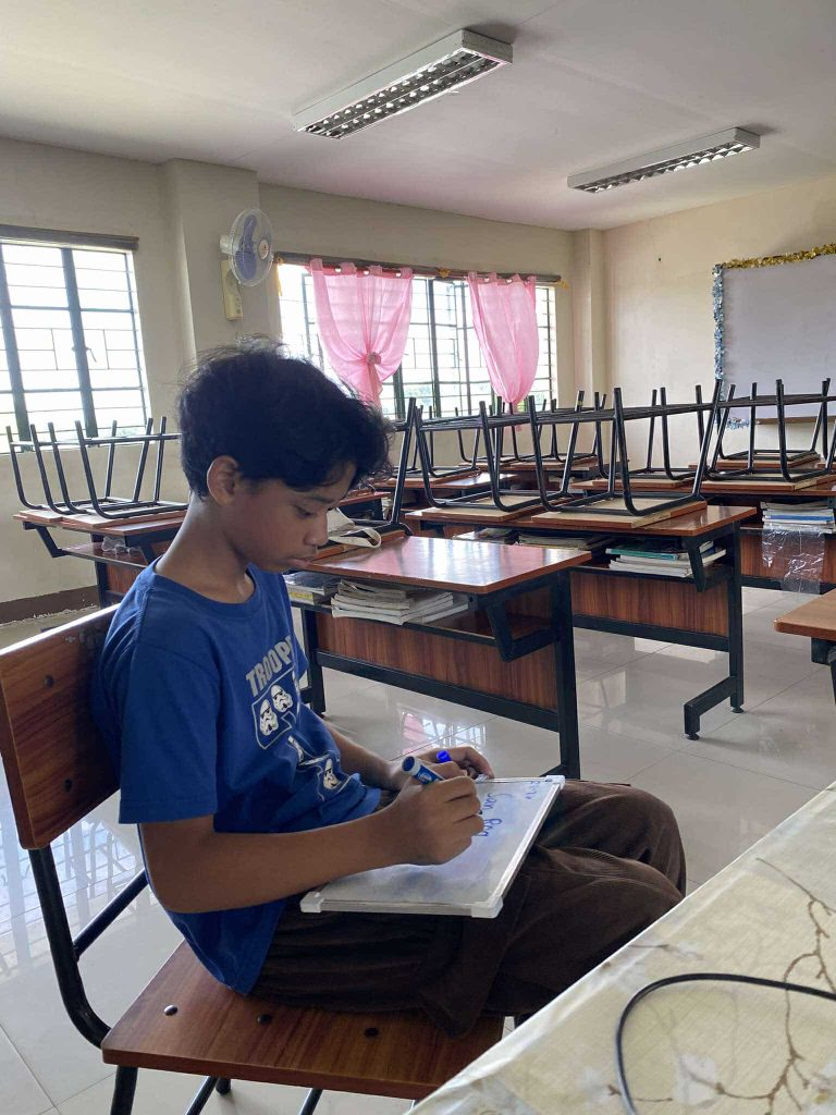 Trainer, Ms. Claudine G. Altar prepares student,Don Raffa Lucas S. Caprecho, for the upcoming “Itanong Mo sa taga-Pasay Quiz Bee”